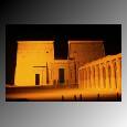 Evening lights shine on the first pylon at the Temple of Isis along the Nile River. 